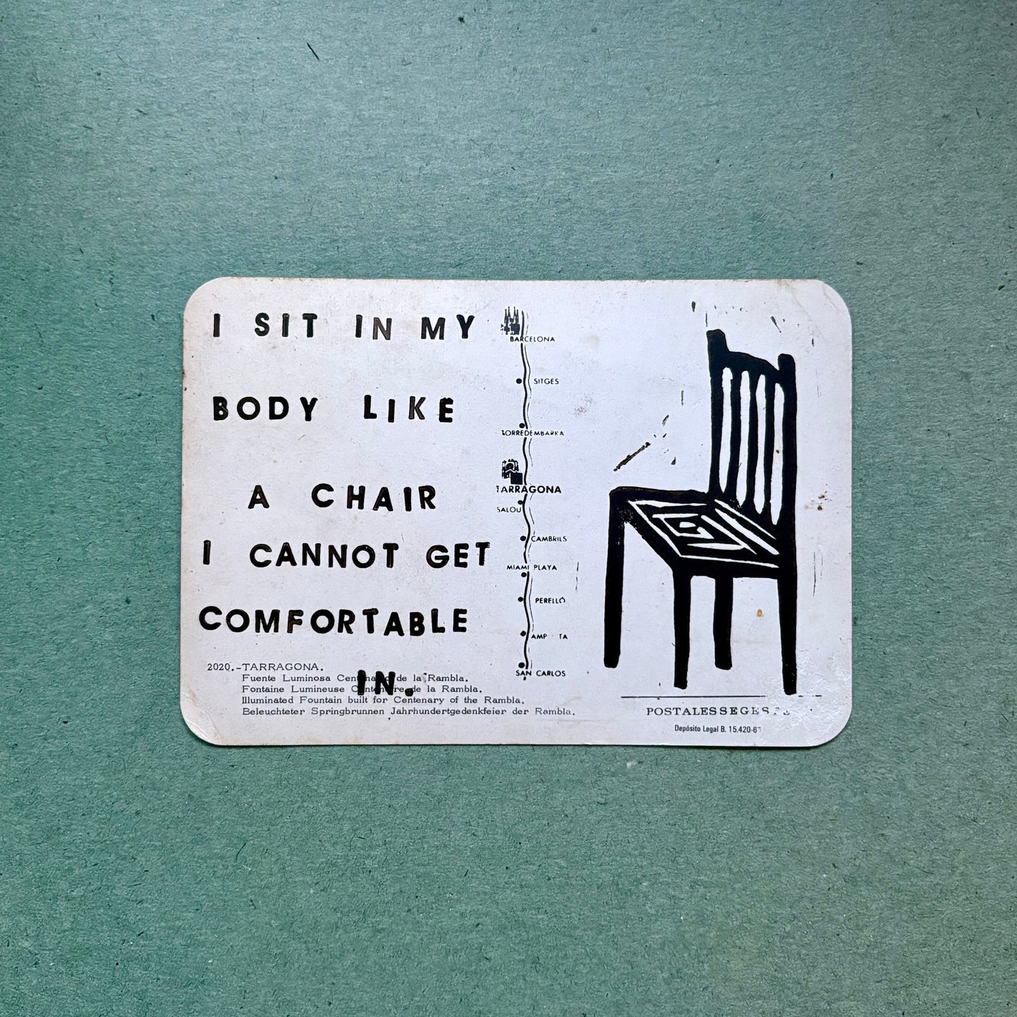 Card with text and a chair illustration on a teal background