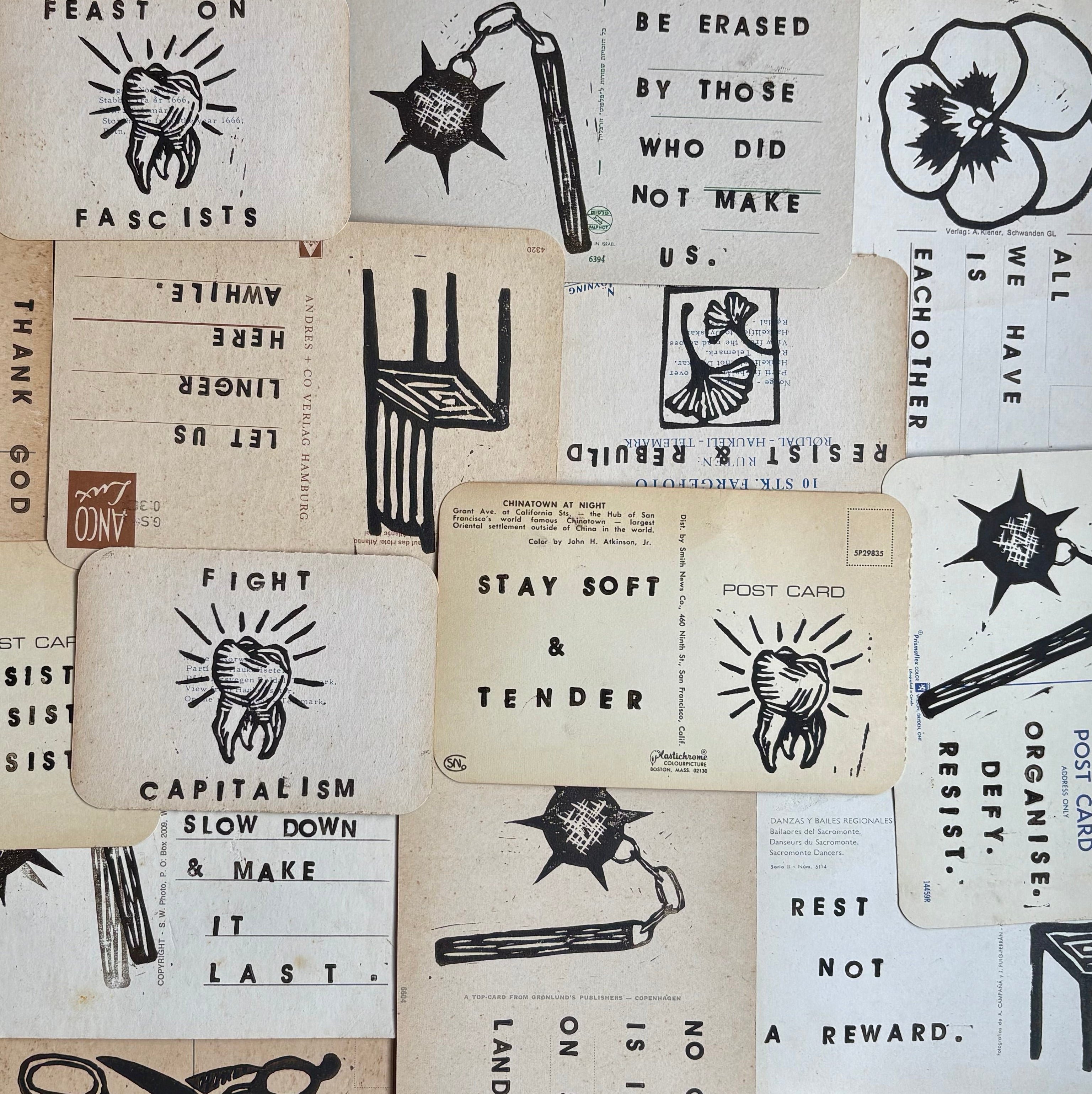 Collection of black and white printed cards on a cardboard background