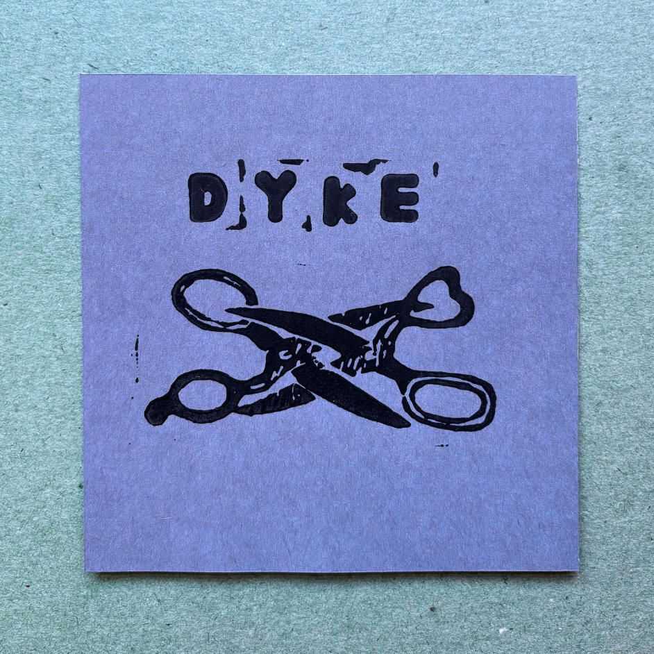 Purple square with black text 'DYKE' and crossed scissors on a textured blue background